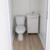 Als büro mit toilette ausgestatteter container